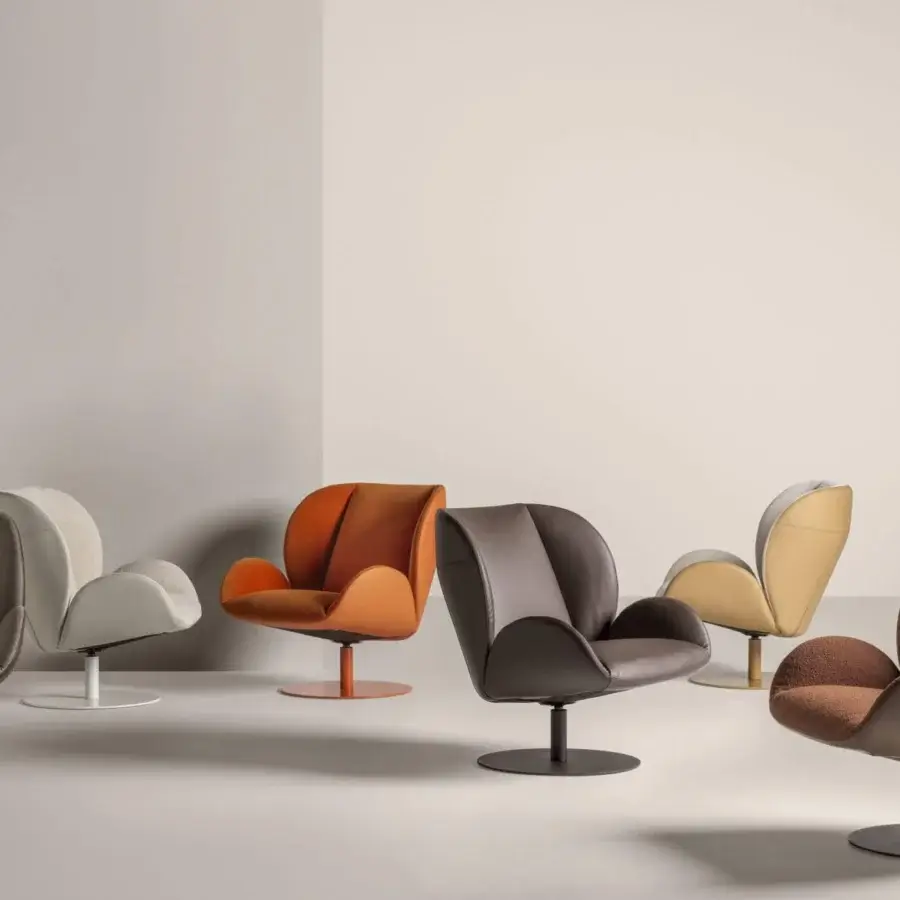 Exceptional Frag Ocean lounge chair in warm orange textile with ergonomic cushioning and central steel swivel base