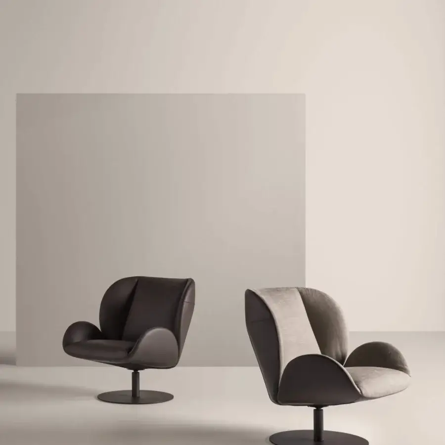 Harmonious Frag Ocean lounge chair in dark brown leather with a steel swivel base and ergonomic cushions