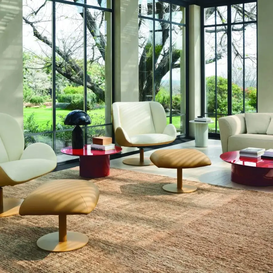 Exceptional Frag Ocean lounge chair with tan leather and off-white textile seating, supported by a central steel swivel base with return mechanism