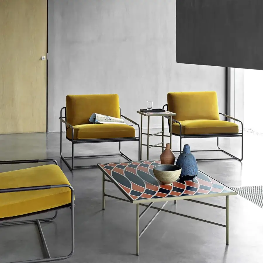 Captivating Frag Riviera lounge chair with sleek metal tubing and luxurious mustard yellow saddle leather upholstery crafted in Italy