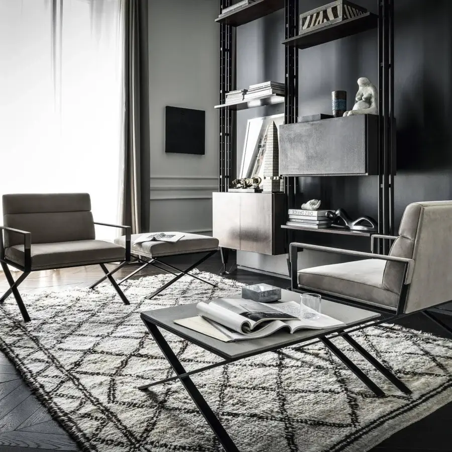 Distinctive Frag Sahrai lounge chair with horizontally flipped matte black metal base and light grayish-beige textile upholstery