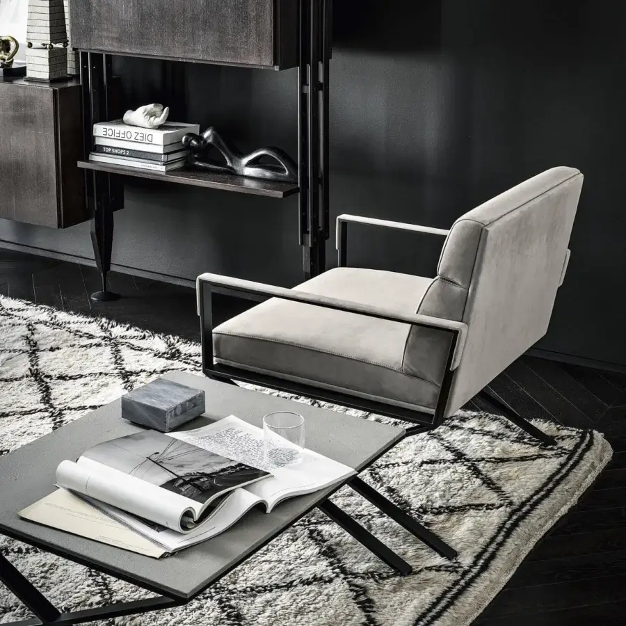 Superior Frag Sahrai lounge chair in light gray textile with a sleek dark metal "X" base crafted in Italy