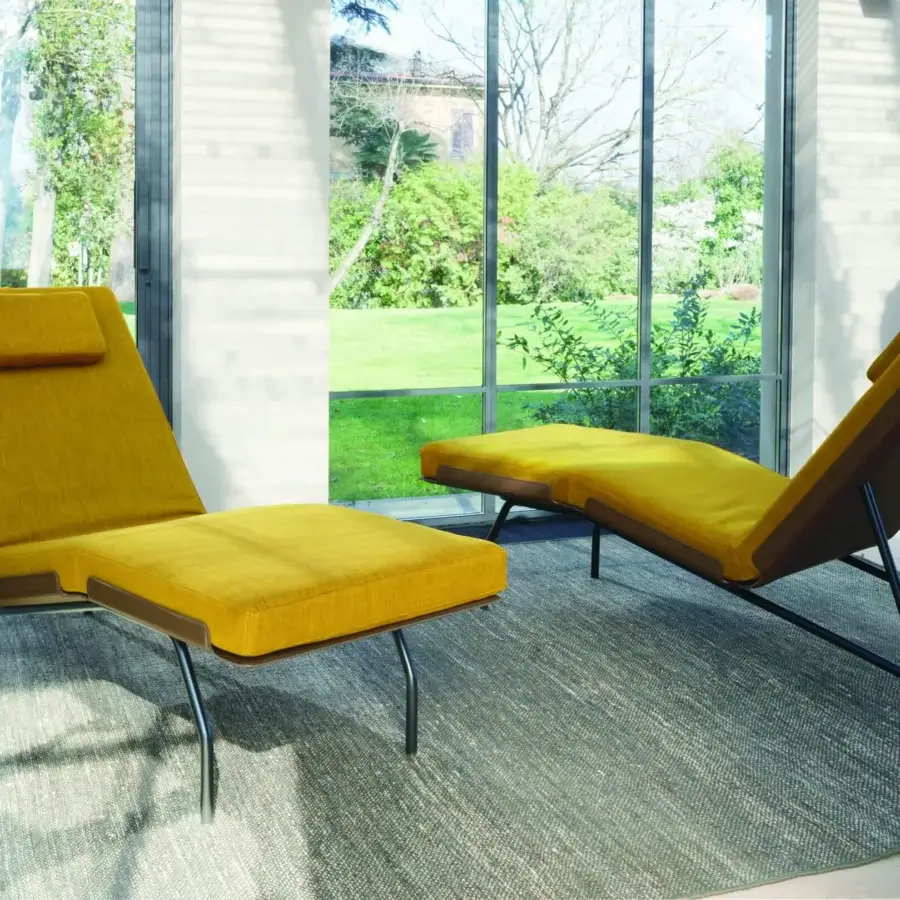 Elegant Frag Caruso chaise lounge in mustard yellow leather with a dark metal tubular steel asymmetrical frame
