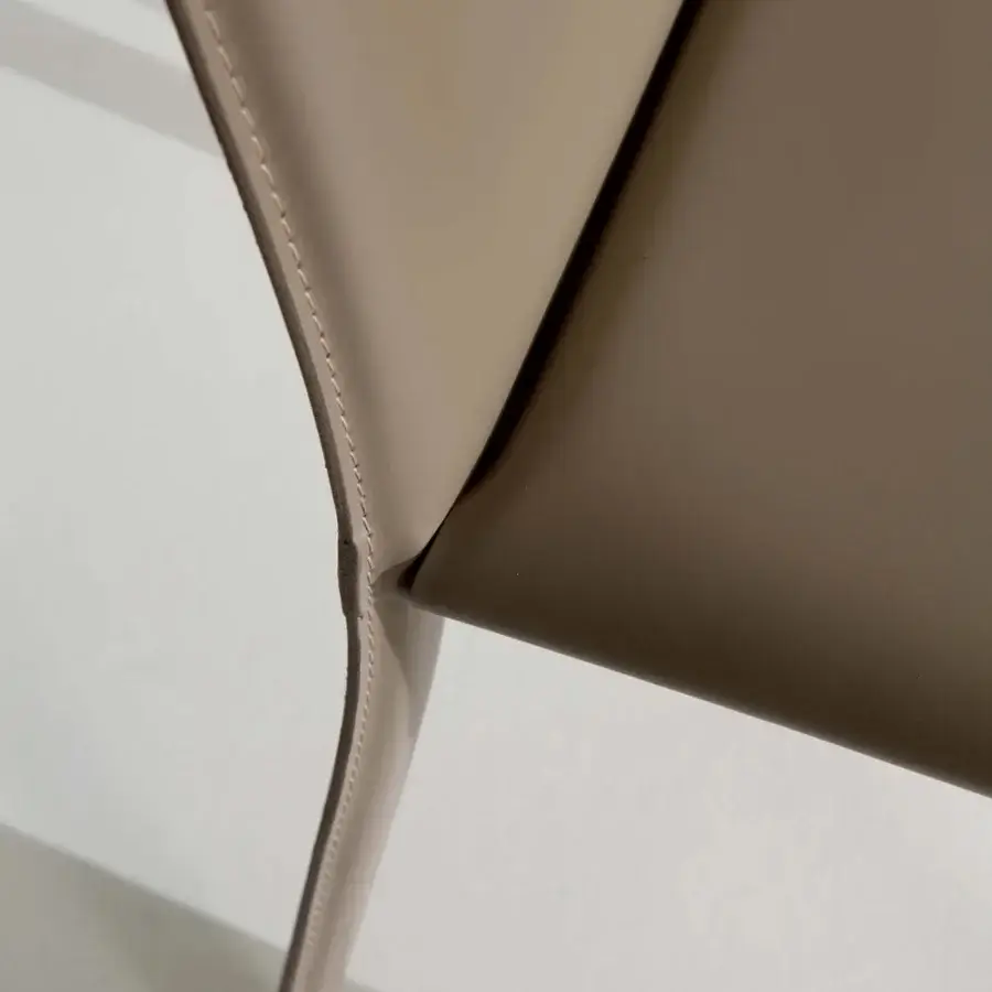Superior Ozzio Italia Lunette chair crafted in light beige synthetic upholstery with elegant curves and meticulous detail