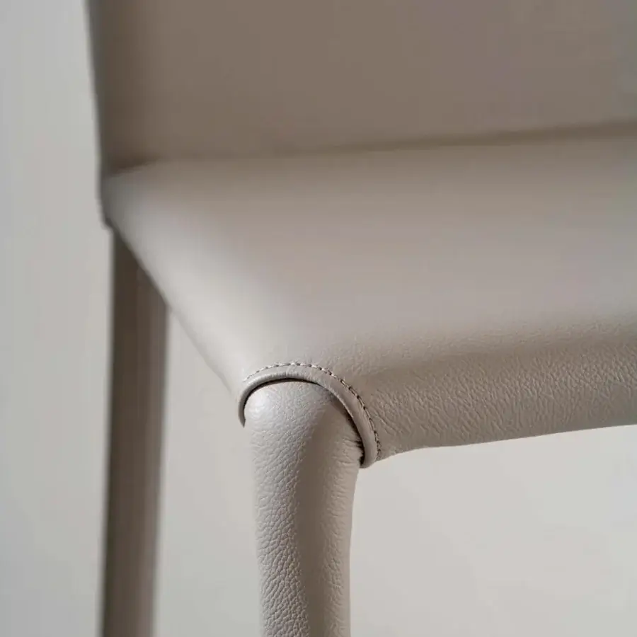 Distinguished Ozzio Italia Lunette chair in light gray synthetic material with geometric silhouette and visible stitching details