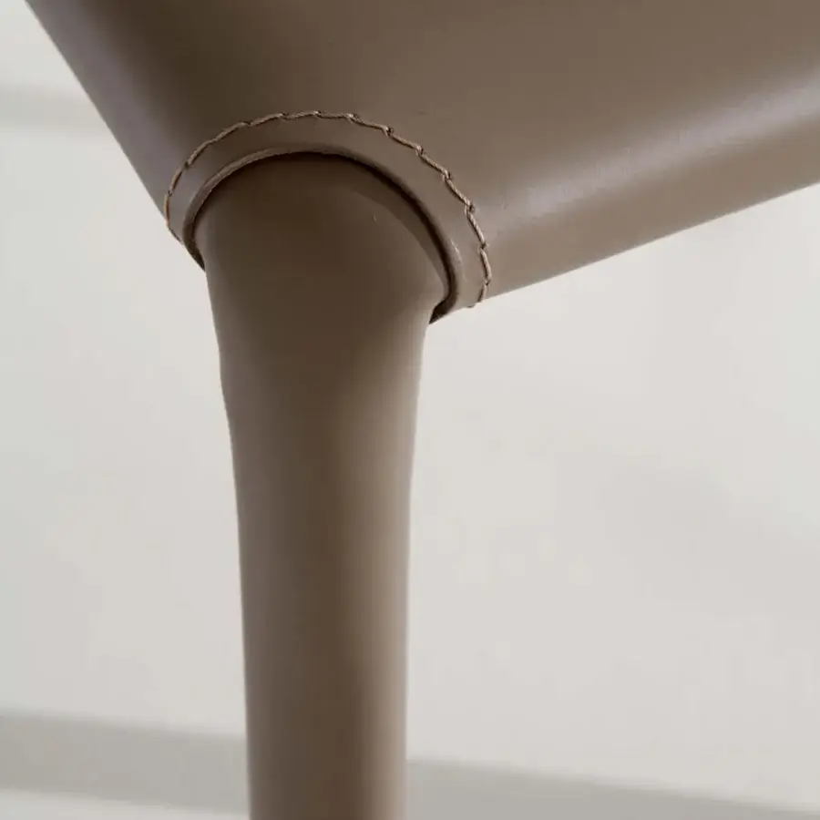 Exceptional Ozzio Italia Lunette chair crafted in warm brown synthetic material with refined stitching details