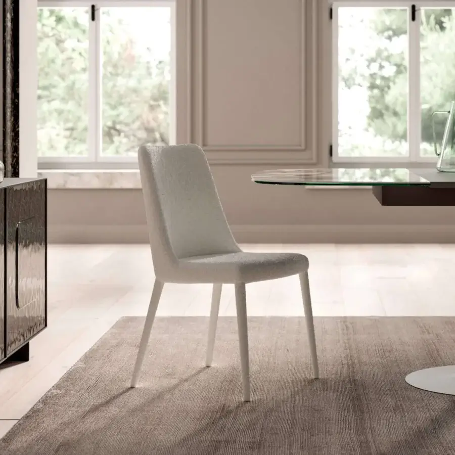 Distinguished Ozzio Italia Sofia chair fully upholstered in light neutral textile with fine stitching detail