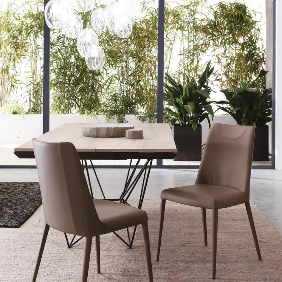 Exceptional Ozzio Italia Sofia chair fully upholstered in light brown smooth matte material with fine stitching