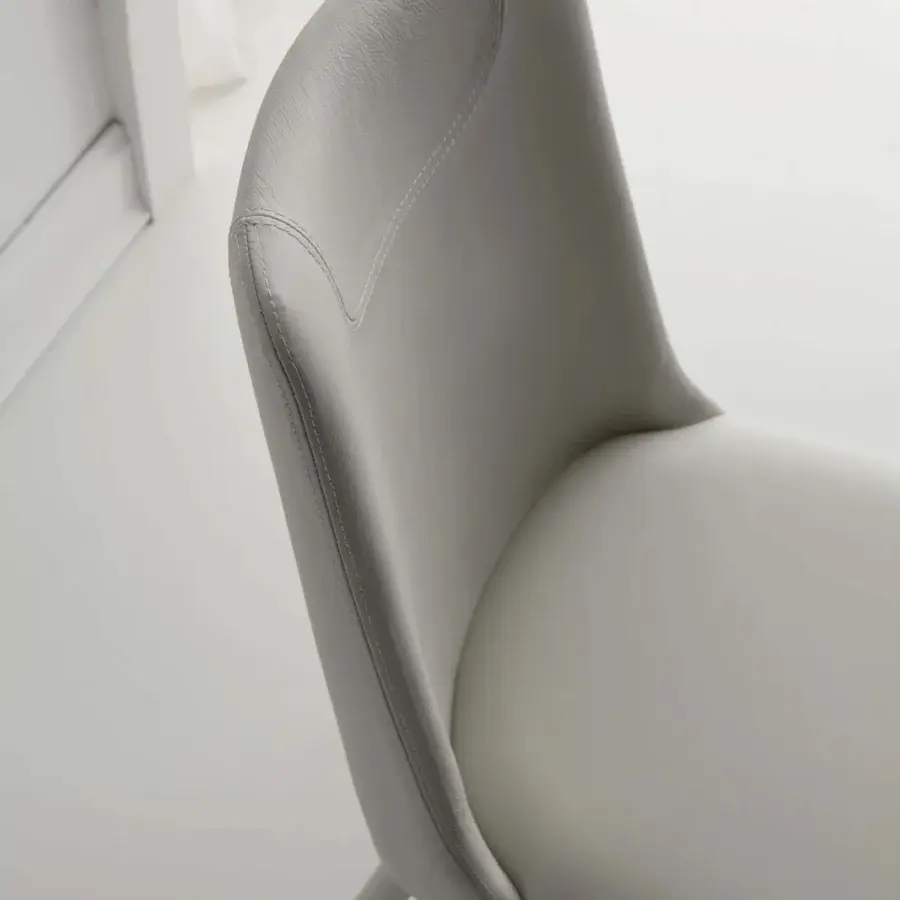 Distinguished Ozzio Italia Sofia chair fully upholstered in light gray with fine stitching and smooth mono-material finish