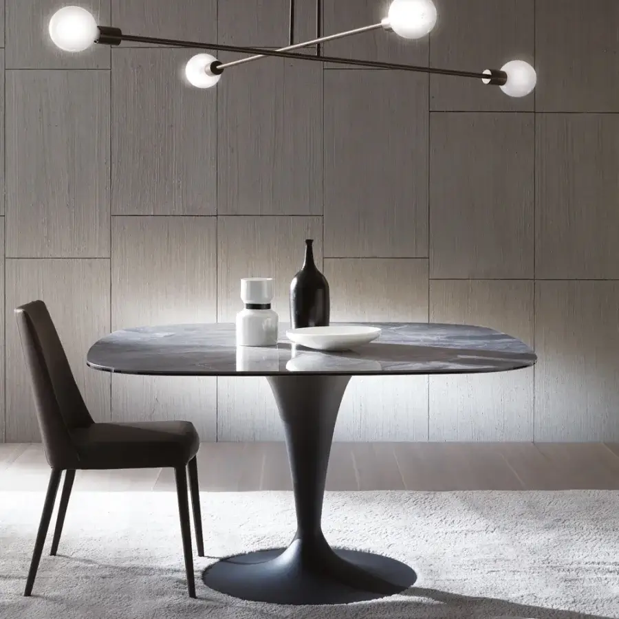 Elegant Ozzio Italia Sofia chair fully upholstered in dark matte textile with fine stitching and tapered metal legs
