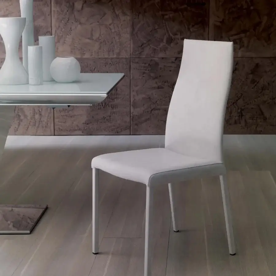 Distinguished Ozzio Italia Blitz chair with sinuous backrest crafted in smooth matte white synthetic material and white metal legs