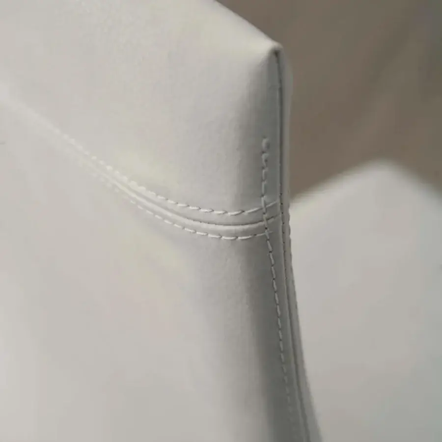 Meticulous Ozzio Italia Blitz chair with sinuous back crafted in smooth white synthetic material and defined stitching details