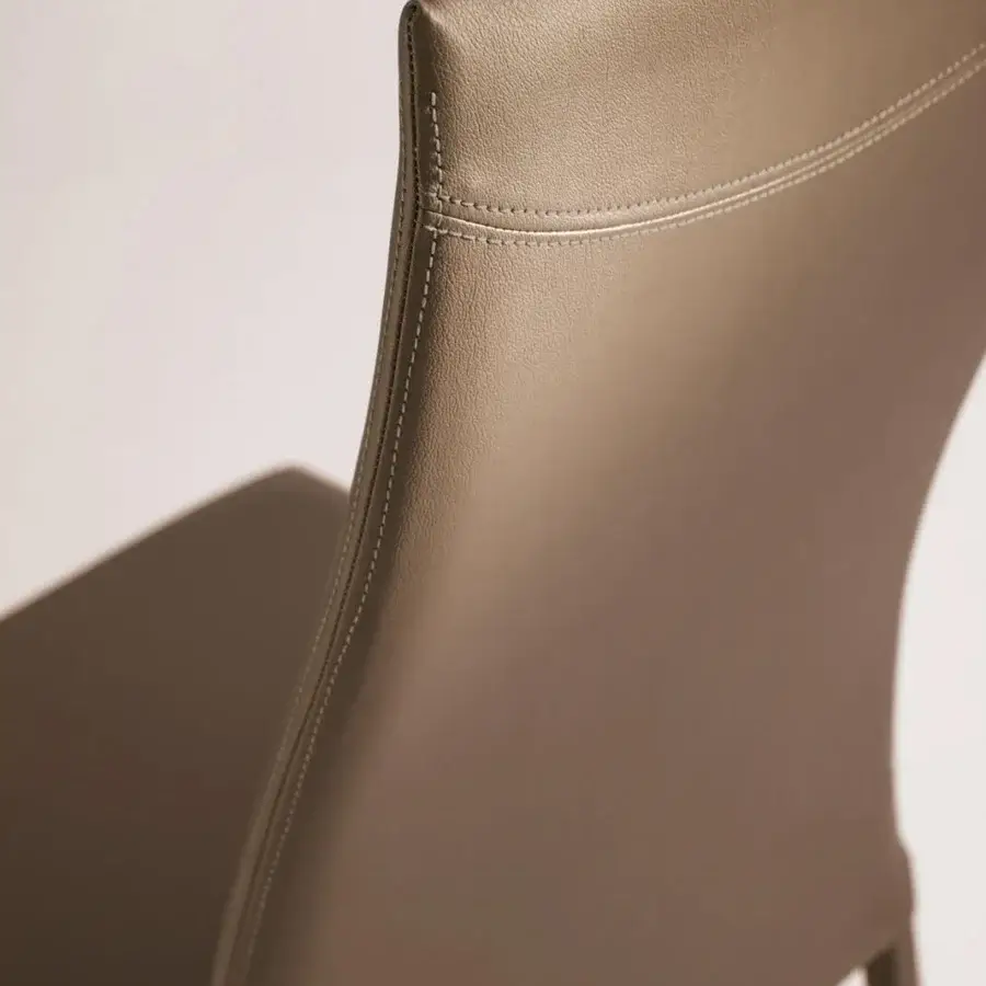 Superior Ozzio Italia Blitz chair with sinuous back upholstered in smooth brown synthetic leather and minimalist metal legs
