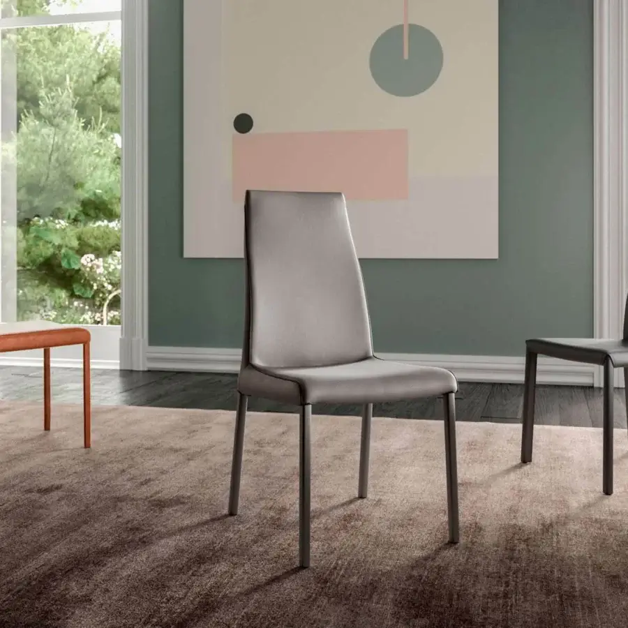 Distinguished Ozzio Italia Blitz chair with sinuous back and dark metal rear legs in medium gray leather finish