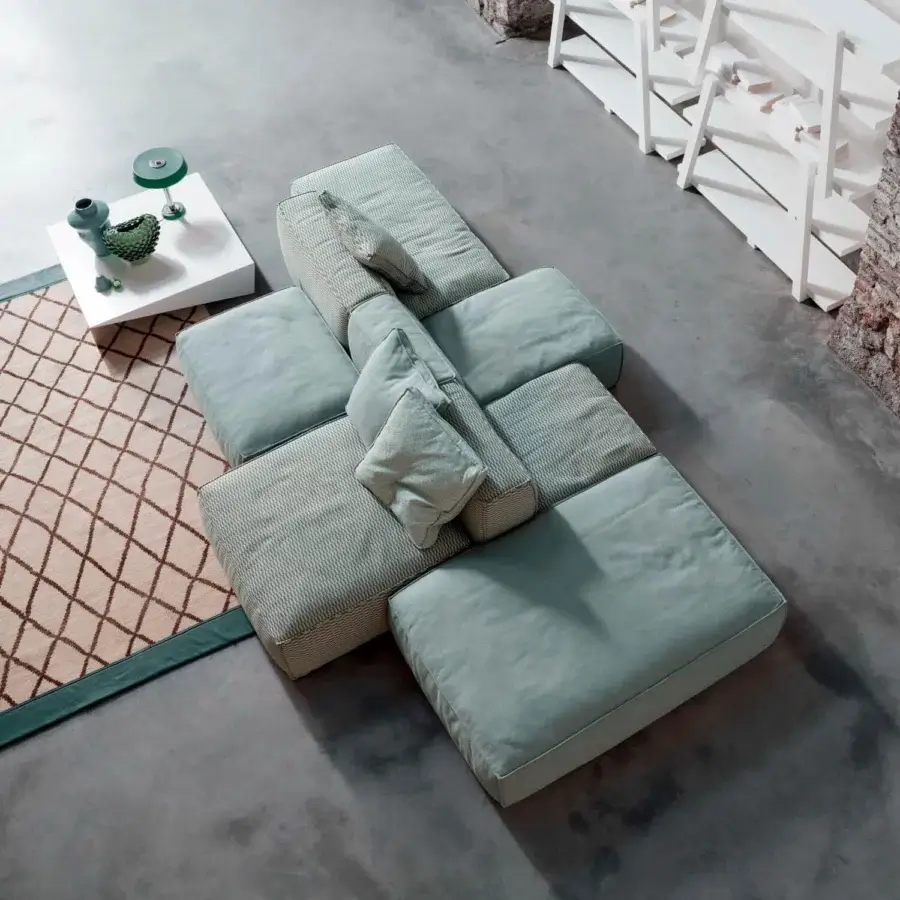 Superior Bonaldo Peanut sectional with light blue-green textile upholstery and anthracite grey wood feet