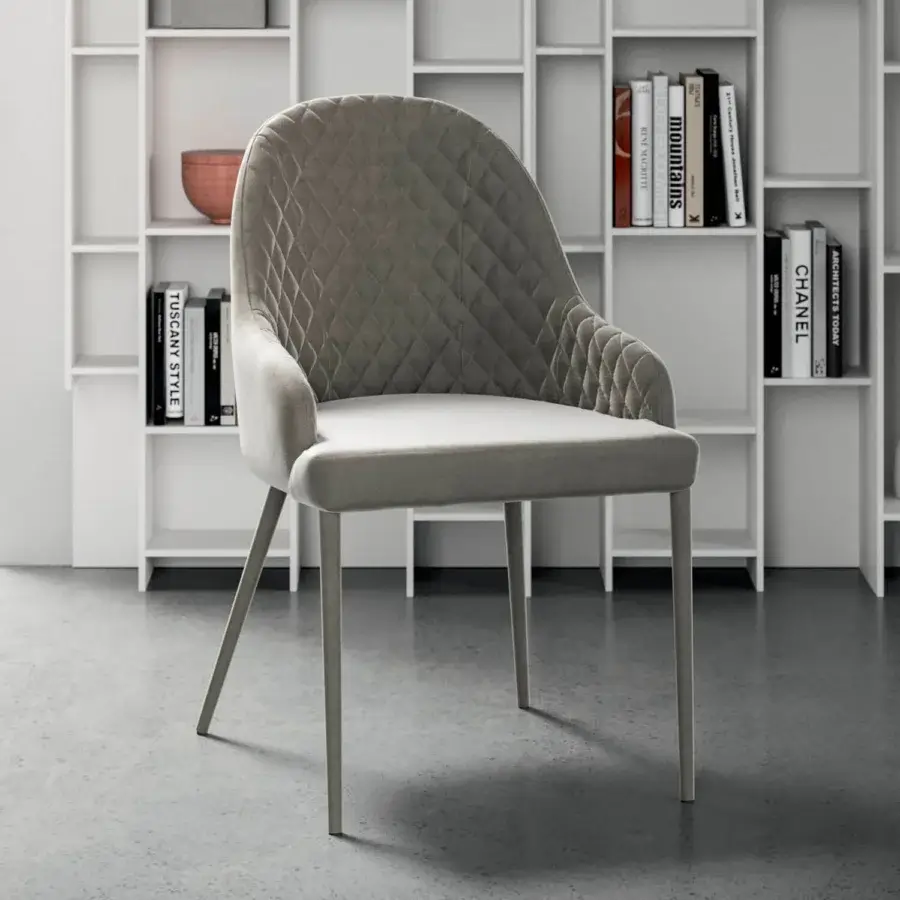 Elegant Ozzio Italia Betta armchair with quilted cover and slender angled metal legs in matte gray finish