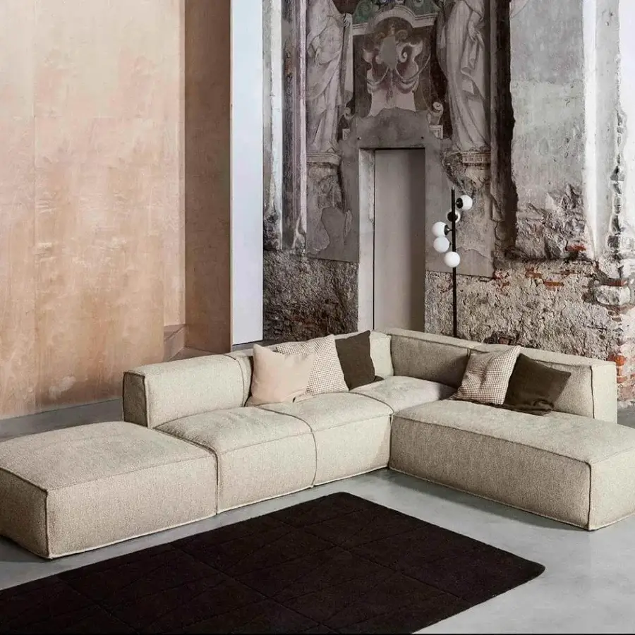 Elegant Bonaldo Peanut sectional with light beige fabric upholstery and textured matte finish built with anthracite grey wood feet