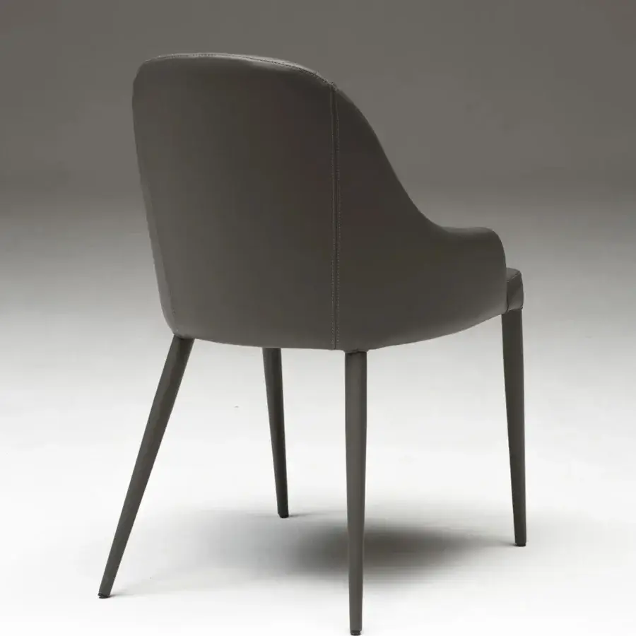 Superior Ozzio Italia Betta armchair with quilted dark gray upholstery and slender dark gray metal legs