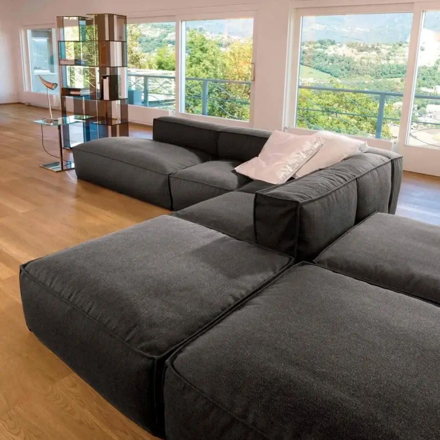 Sophisticated Bonaldo Peanut sectional with matte dark gray textile upholstery and anthracite wood feet