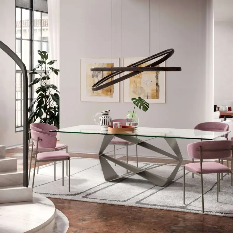 Elegant Ozzio Italia Ego chair with curved backrest upholstered in muted rose textile and painted metal structure