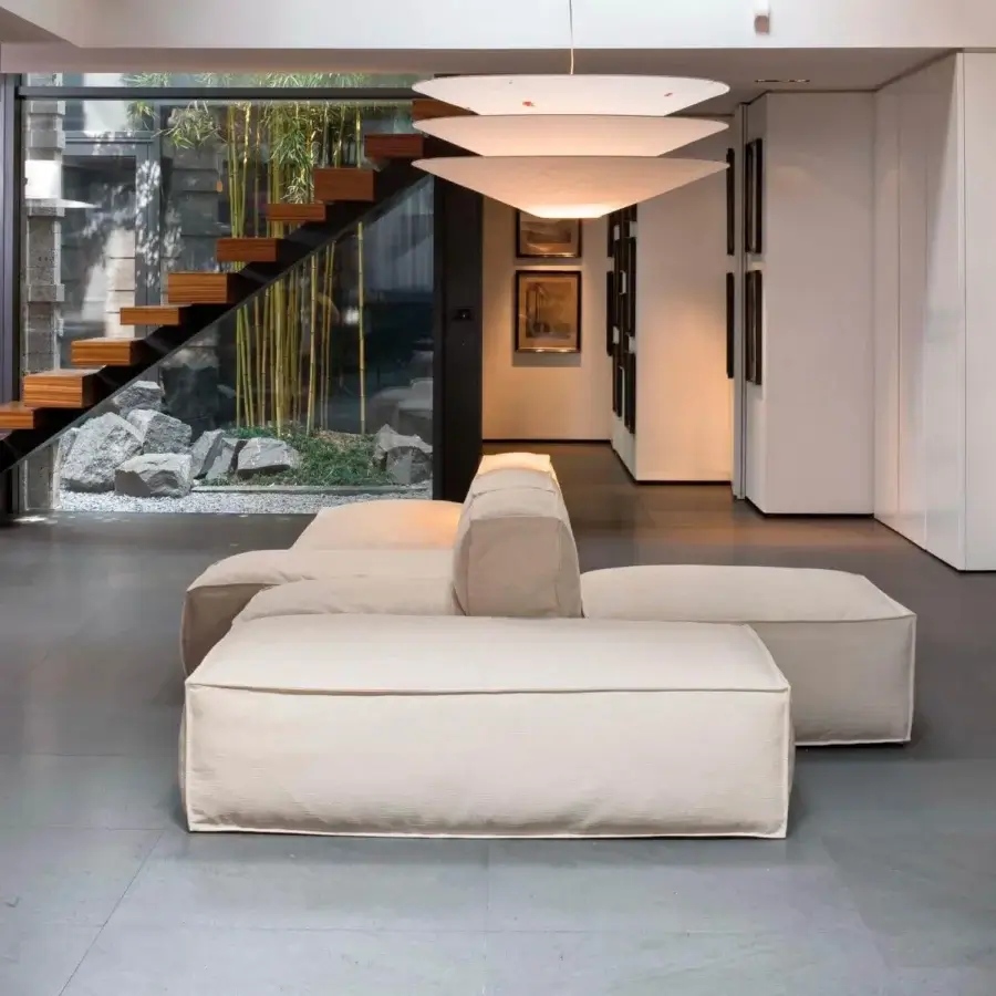 Lavish Bonaldo Peanut sectional with textured off-white fabric upholstery and anthracite grey wood feet