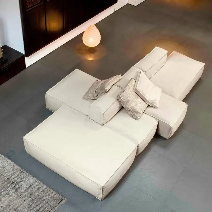 Distinguished Bonaldo Peanut sectional with light off-white fabric upholstery and anthracite grey wood feet