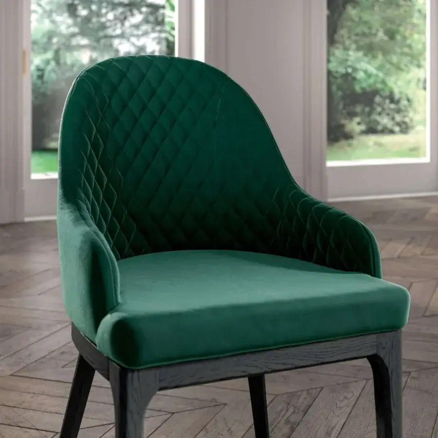 Exceptional Ozzio Italia Thelma armchair with wrapping backrest and ergonomic seat in deep green quilted textile with a dark wooden frame