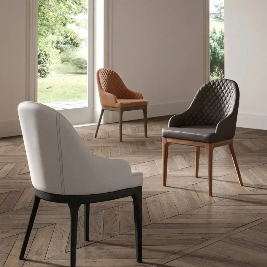 Elegant Ozzio Italia Thelma armchair with light gray textile and dark matte wooden legs exemplifies contemporary Italian design