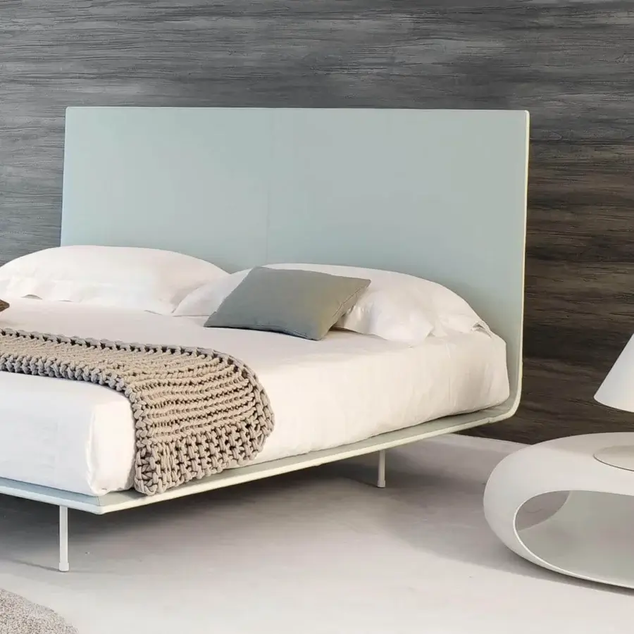 Distinguished Bonaldo Thin bed with continuous light blue fabric lines and quilted diamond pattern built with metal feet
