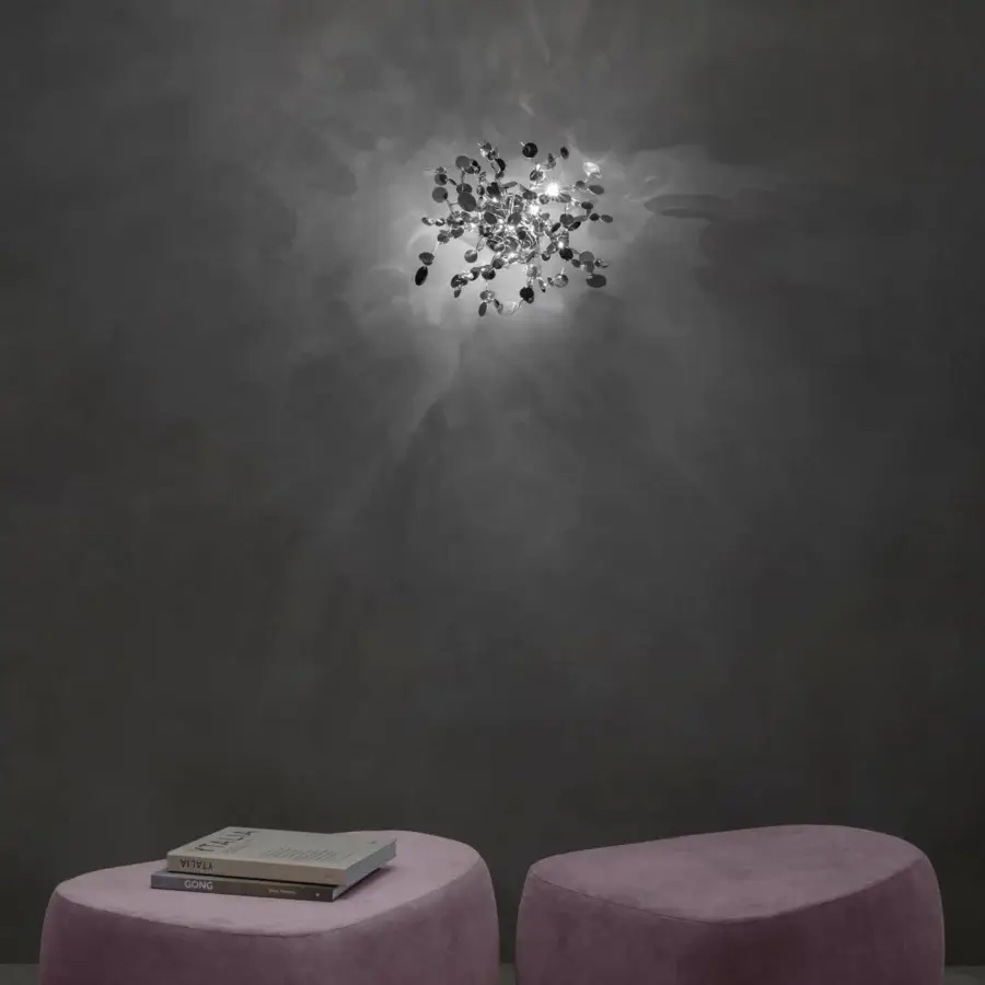 Luxury Terzani Argent wall lamp crafted in polished silver with hand-joined metal discs forming a radiant starburst design