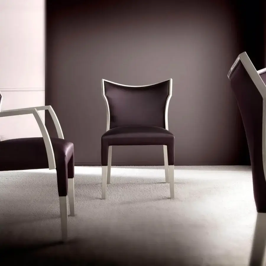 Elegant Costantini Pietro Villa chair with plum-purple leather upholstery and high gloss beechwood frame