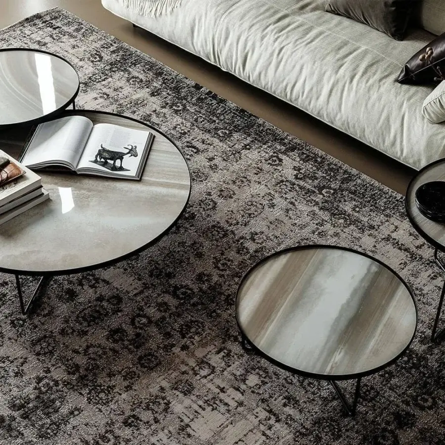 Exceptional Cattelan Italia Billy Keramik coffee table with swirling gray and white ceramic and glossy black metal legs crafted with a Brushed finish
