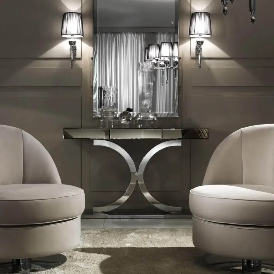 Elegant DV Home Collection Kent Plus console with bronze mirror and intersecting stainless steel curves