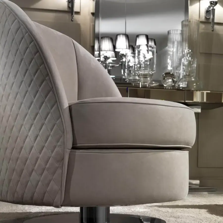 Distinguished DV Home Collection Charlotte lounge chair with light taupe fabric upholstery and shining steel base