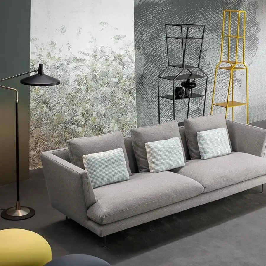 Sophisticated Bonaldo Lars sofa with light gray textile upholstery and slender metal feet, complemented by checkered cushions
