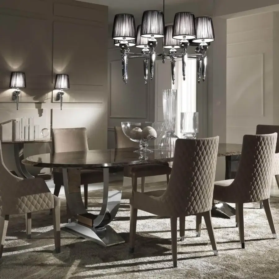 Elegant DV Home Collection Byron armchair with quilted muted beige fabric and stainless steel feet