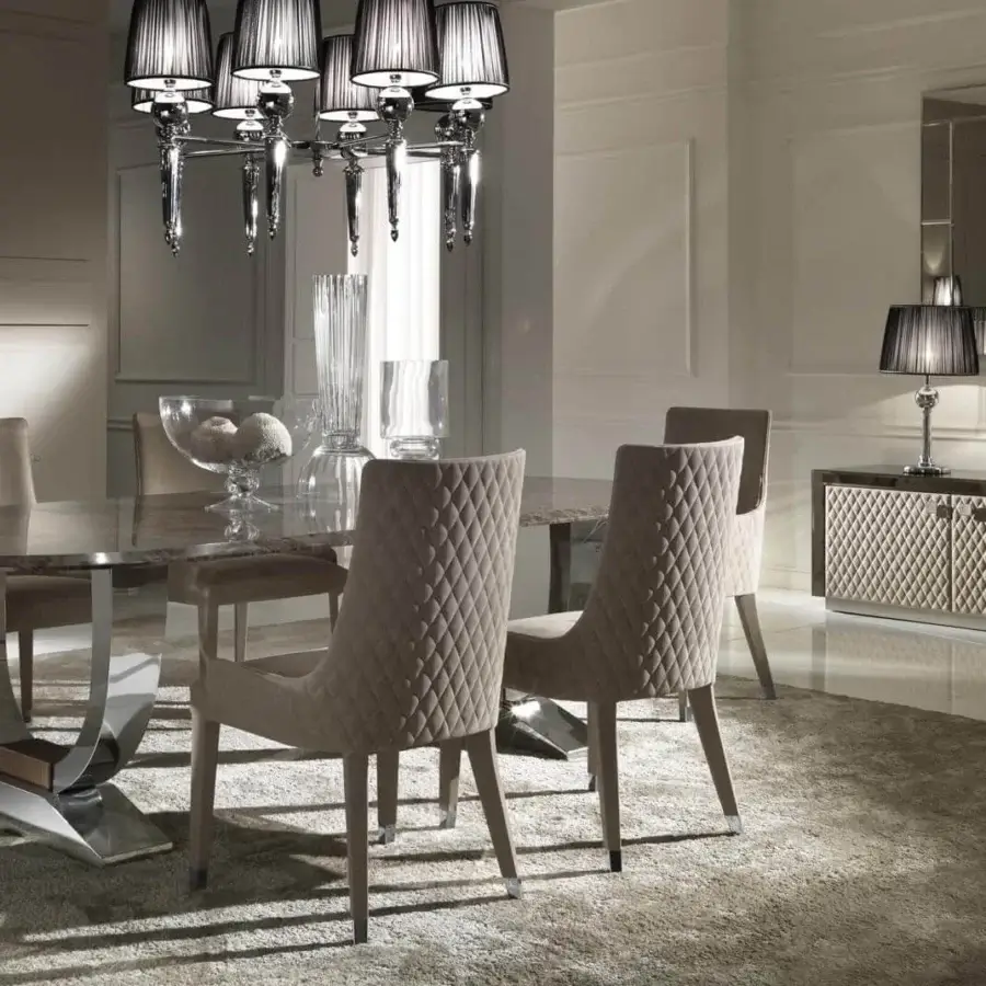 Sophisticated DV Home Collection Byron chair with quilted beige textile upholstery and solid wood legs