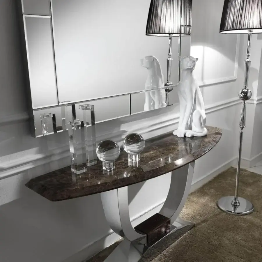 Exceptional DV Home Collection Hermes console with a semi-oval marble top and lustrous stainless steel pedestal base