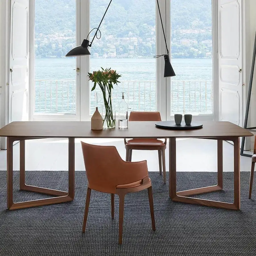 Elegant Potocco Velis armchair with warm brown leather upholstery and Canaletto walnut frame crafted with smooth finishes