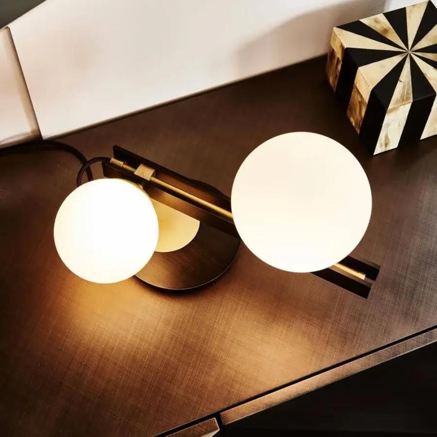 Elegant Cattelan Italia Planeta table lamp with burnished steel and brushed brass accents in satin white blown glass