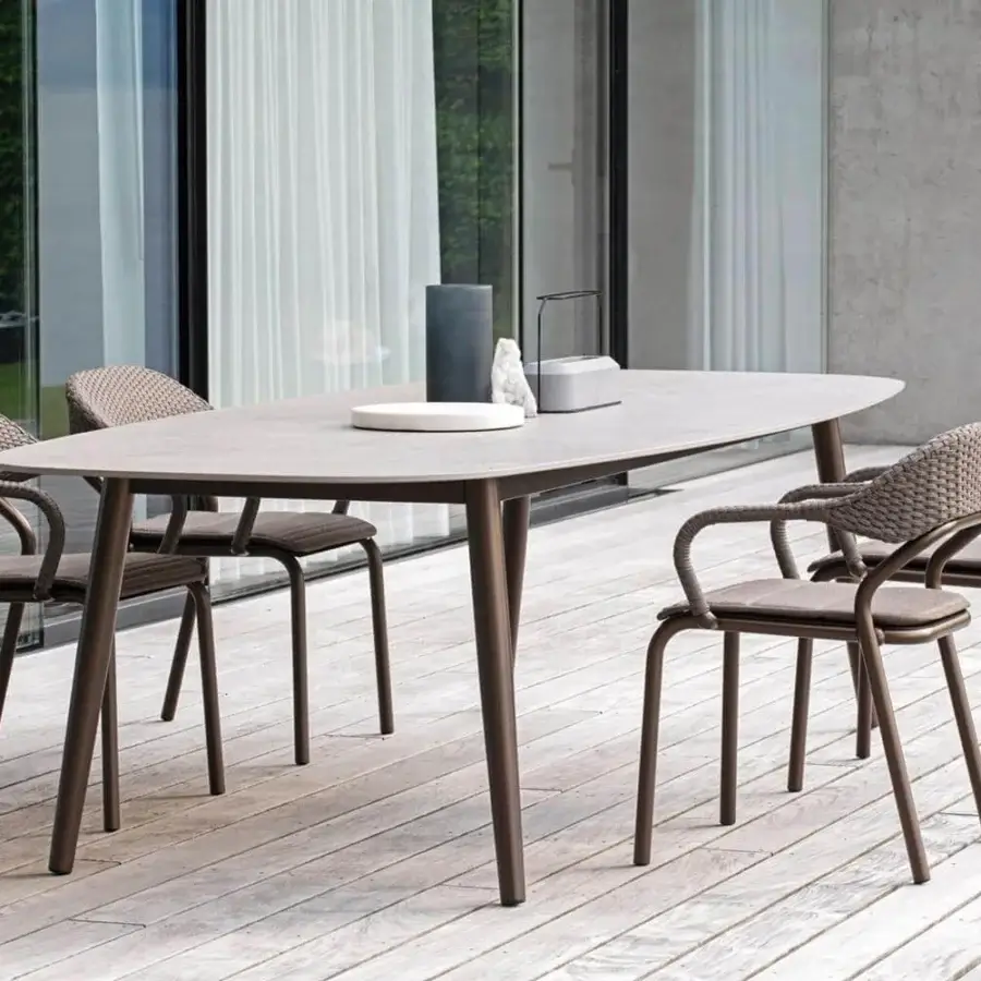 Distinguished Varaschin Noss armchair with aluminum structure and hand-woven brown synthetic fiber rope back