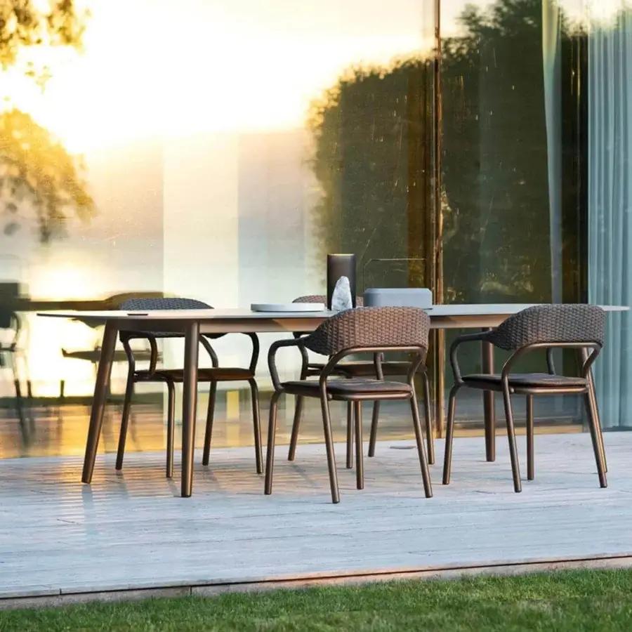 Sophisticated Varaschin Noss armchair with aluminum structure and handwoven medium brown synthetic fiber rope back
