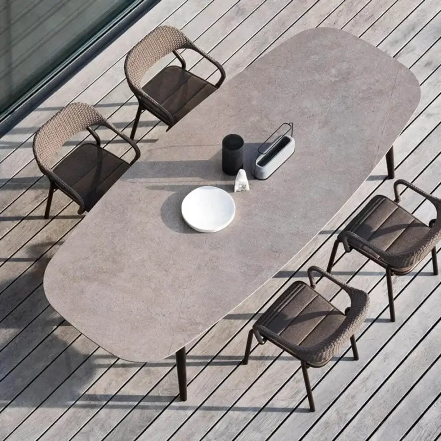 Elegant Varaschin Noss armchair with hand-woven medium brown polypropylene rope and matte metal frame