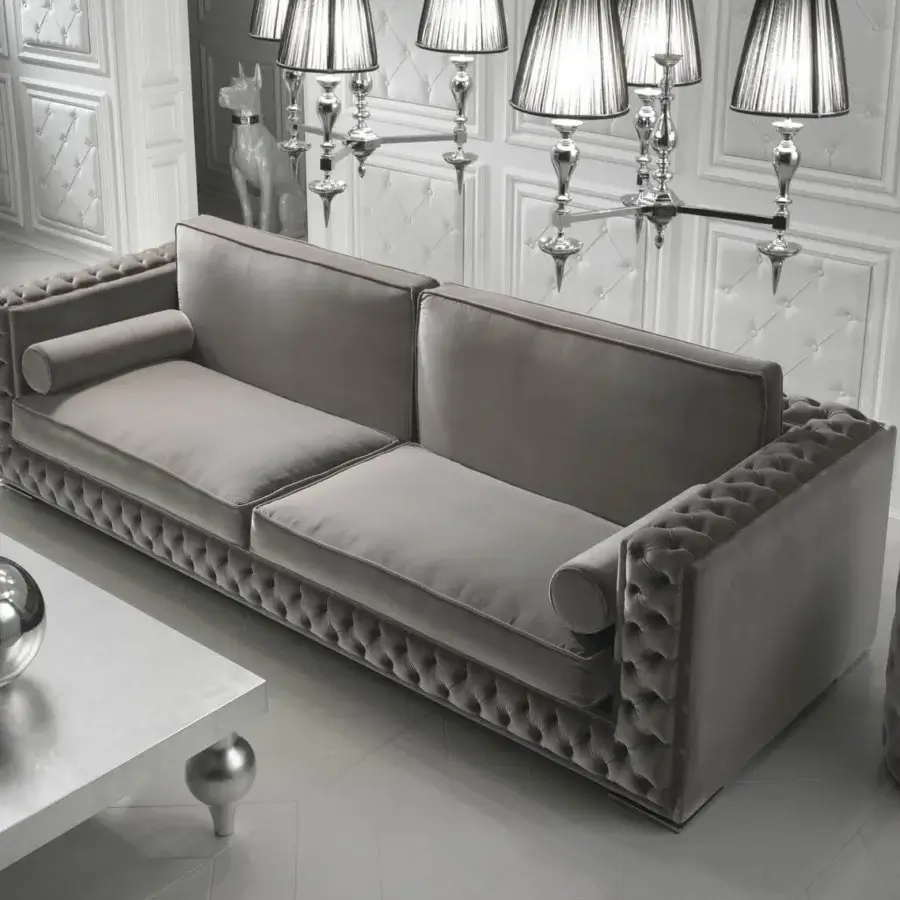 Distinctive DV Home Collection sofa with smooth matte gray textile, tufted detailing and solid wood crafted structure with chrome feet
