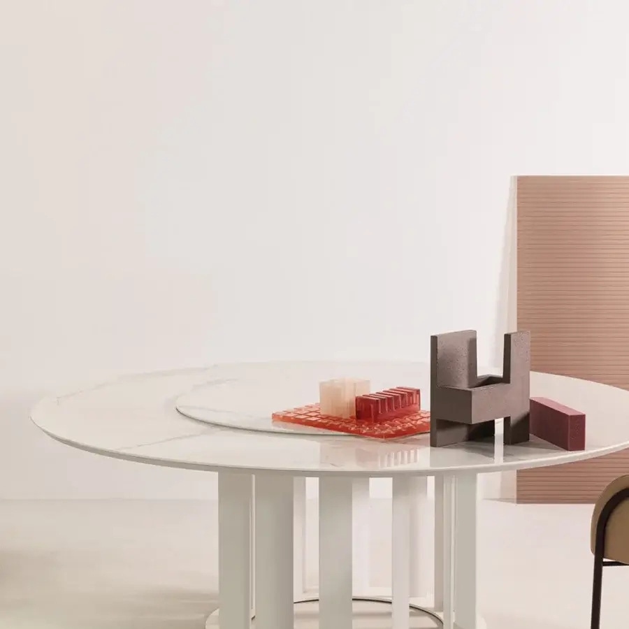 Elegant Cierre1972 Adele armchair with light beige textile upholstery and slim dark metal trim mirroring leather seams