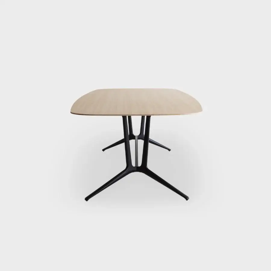 Exceptional Lapalma Trail conference table with a light-colored wood top and dark powder-coated aluminum zoomorphic base