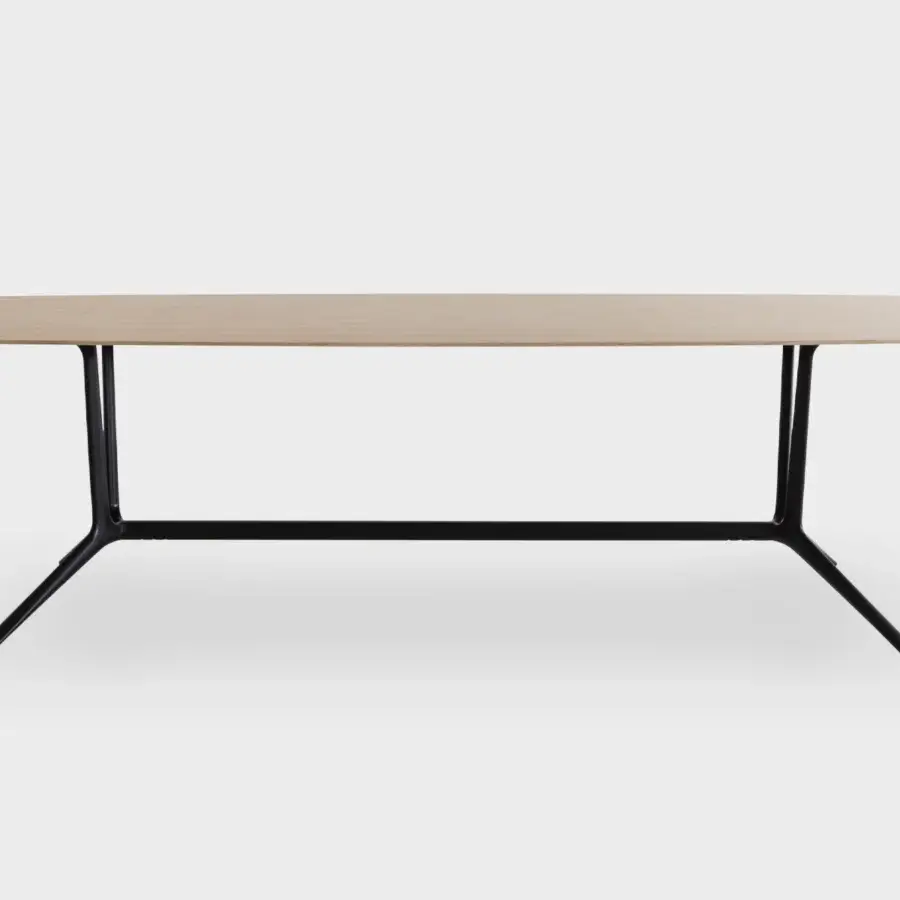 Distinguished Lapalma Trail conference table with a barrel-shaped MDF top and lacquered edges in a light natural wood finish with a black powder-coated aluminum base
