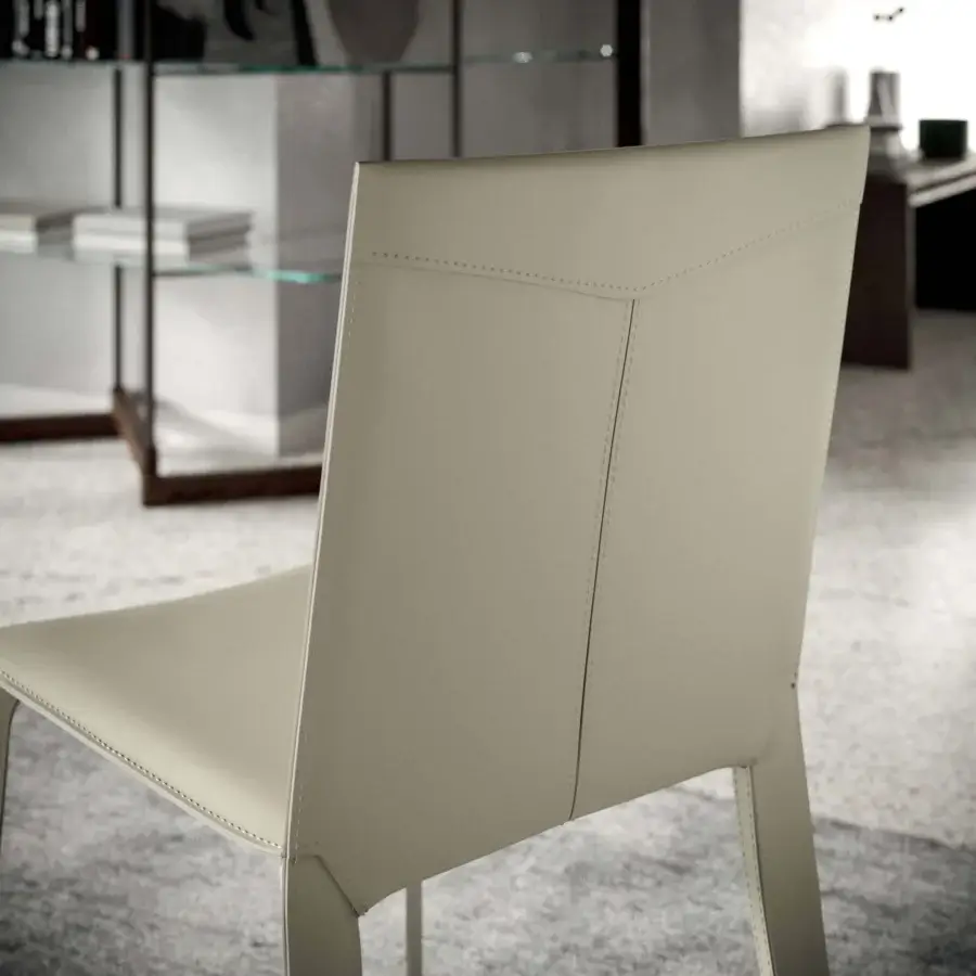 Harmonious Ozzio Italia Frisbee chair in light beige leather unites functionality with contemporary design and a minimalist aesthetic