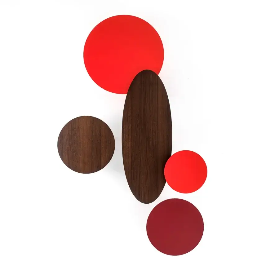 Distinguished Bross Ademar coffee table with lacquered legs and a circular dark brown wood top showcasing red accents