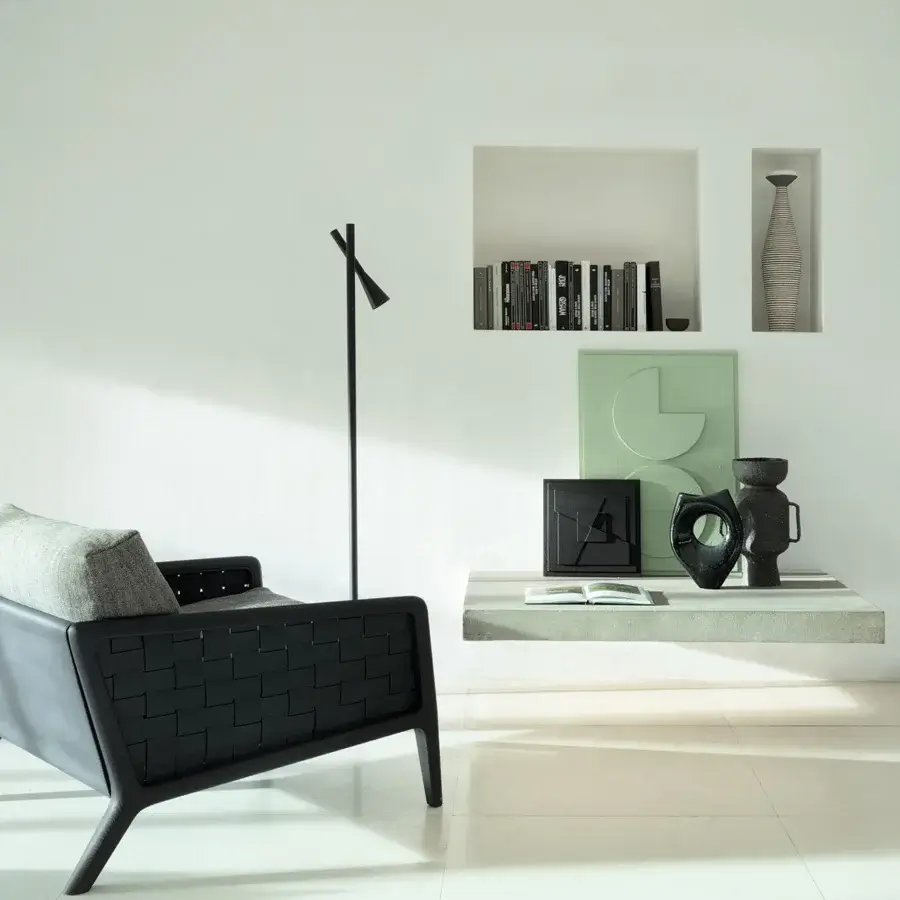 Superior Cierre1972 Iole lounge chair with woven backrest and sleek black finish in geometric silhouette